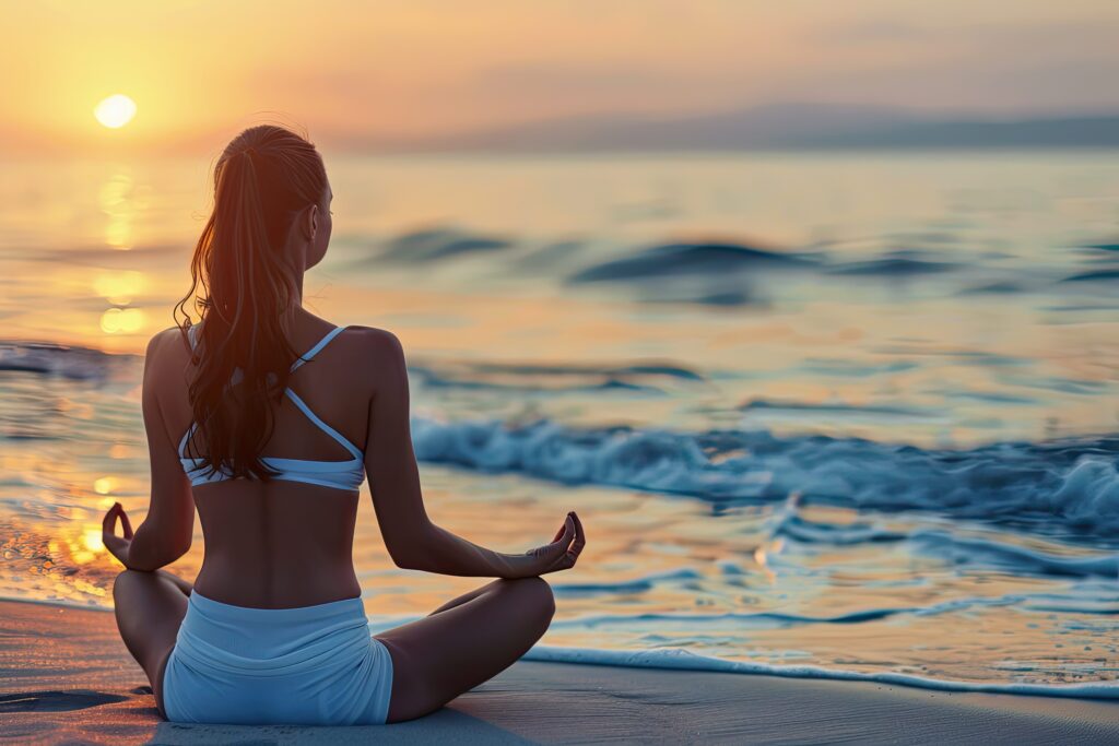 A serene beach scene with a person in a meditative yoga pose A serene beach scene with a person in a meditative yoga pose